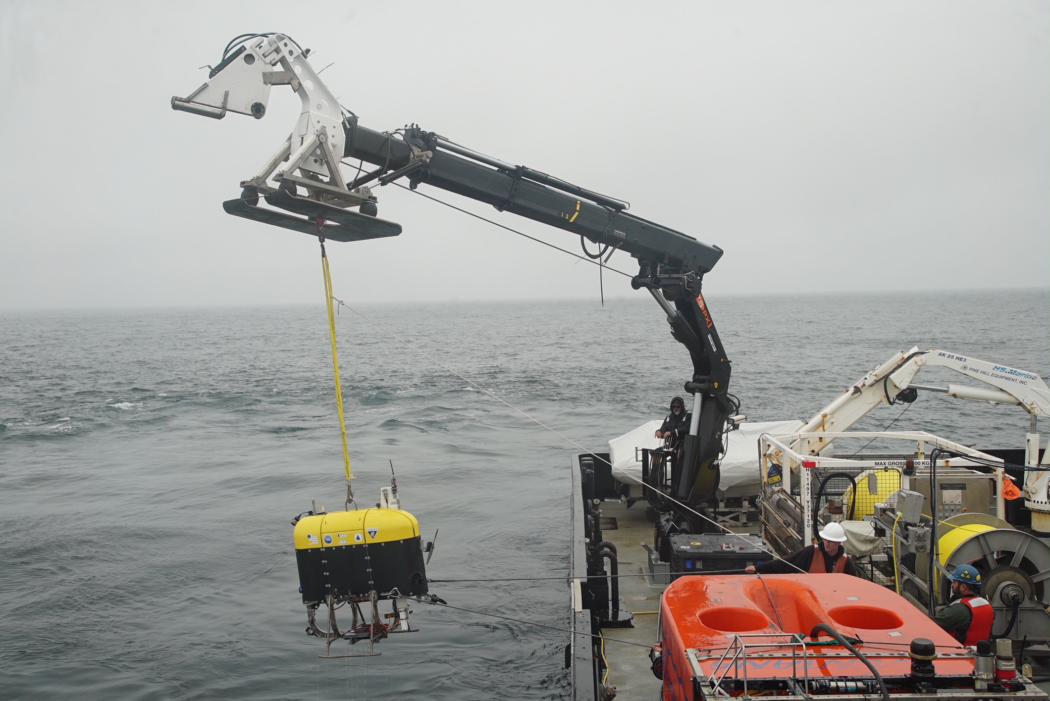 Mesobot is hoisted over the side of a research vessel