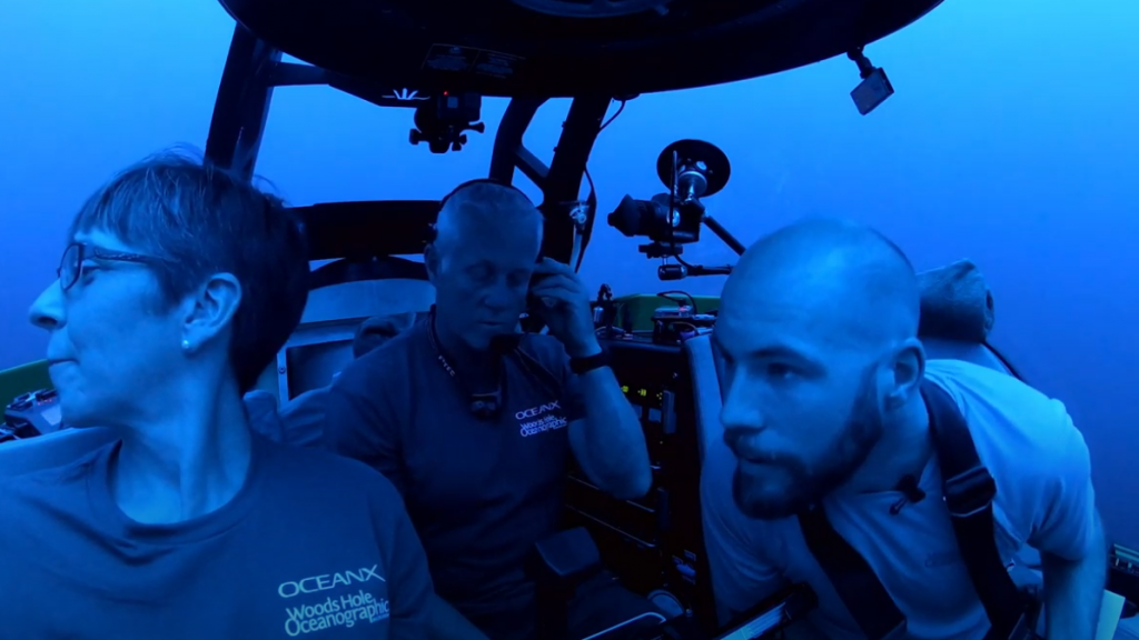 Scientists underwater in a submersible