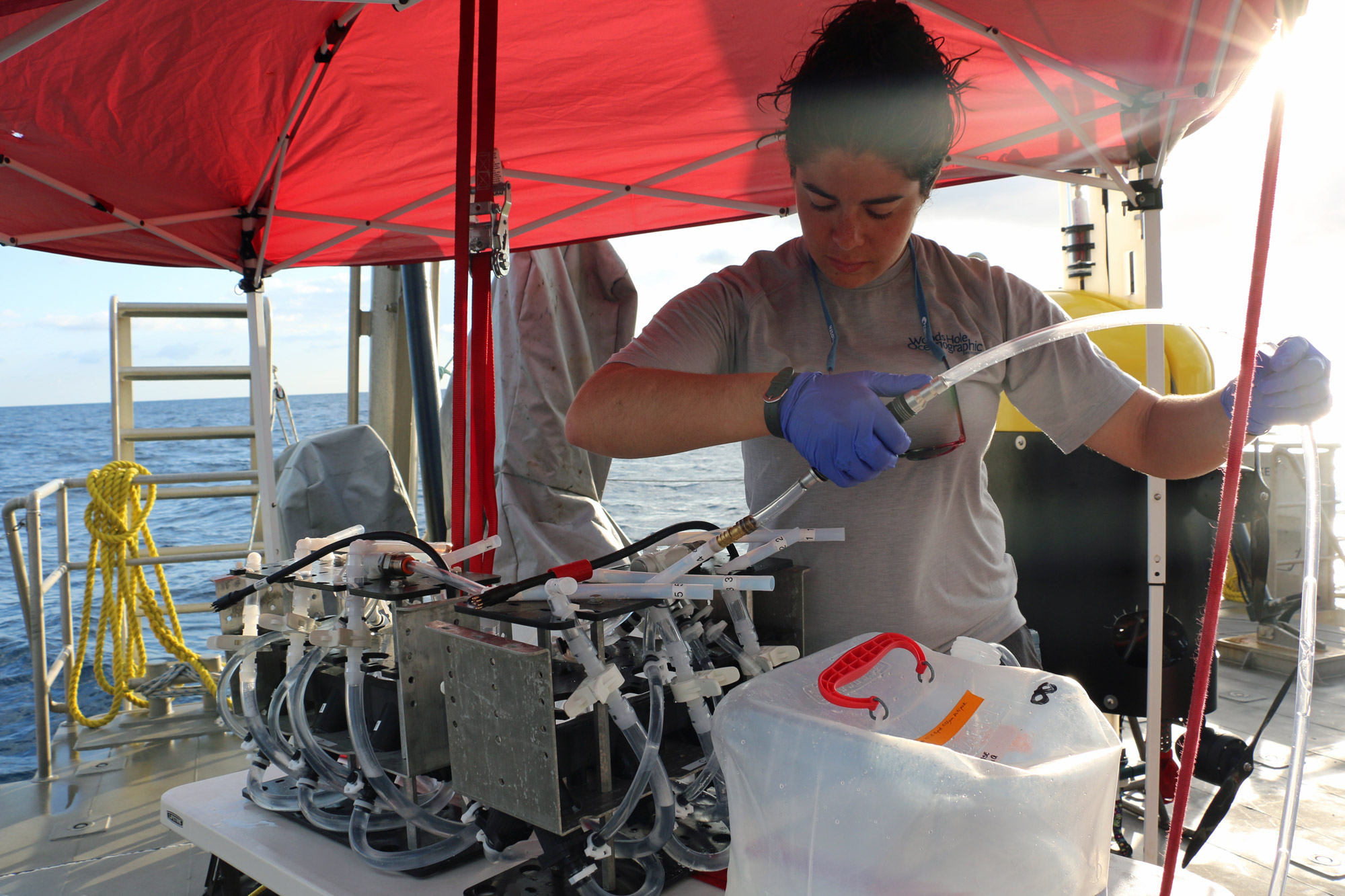 An OTZ research assistant prepares an eDNA sampler for deployment.