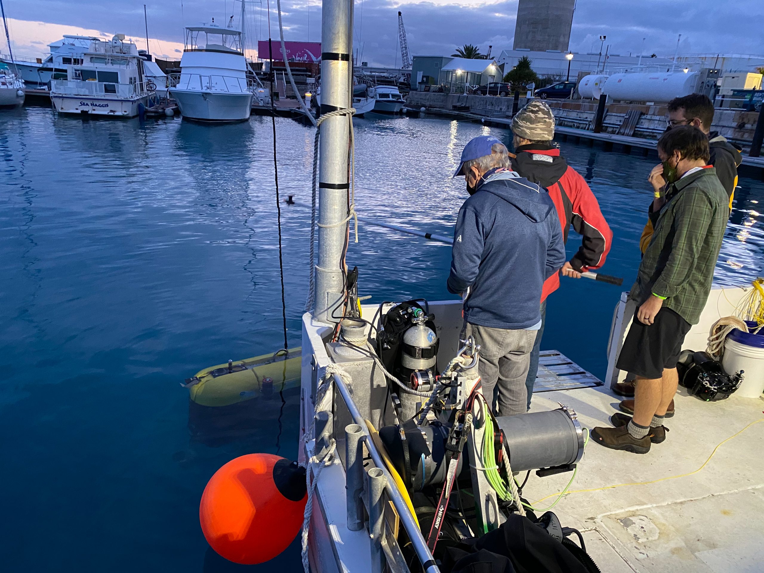 Engineers Dana Yoerger, Evan Kovacs, Jordan Stanway, and Frederick Marin troubleshoot a puzzling issue with in Mesobot’s thrusters. The problem only appeared once the vehicle came into contact with saltwater.