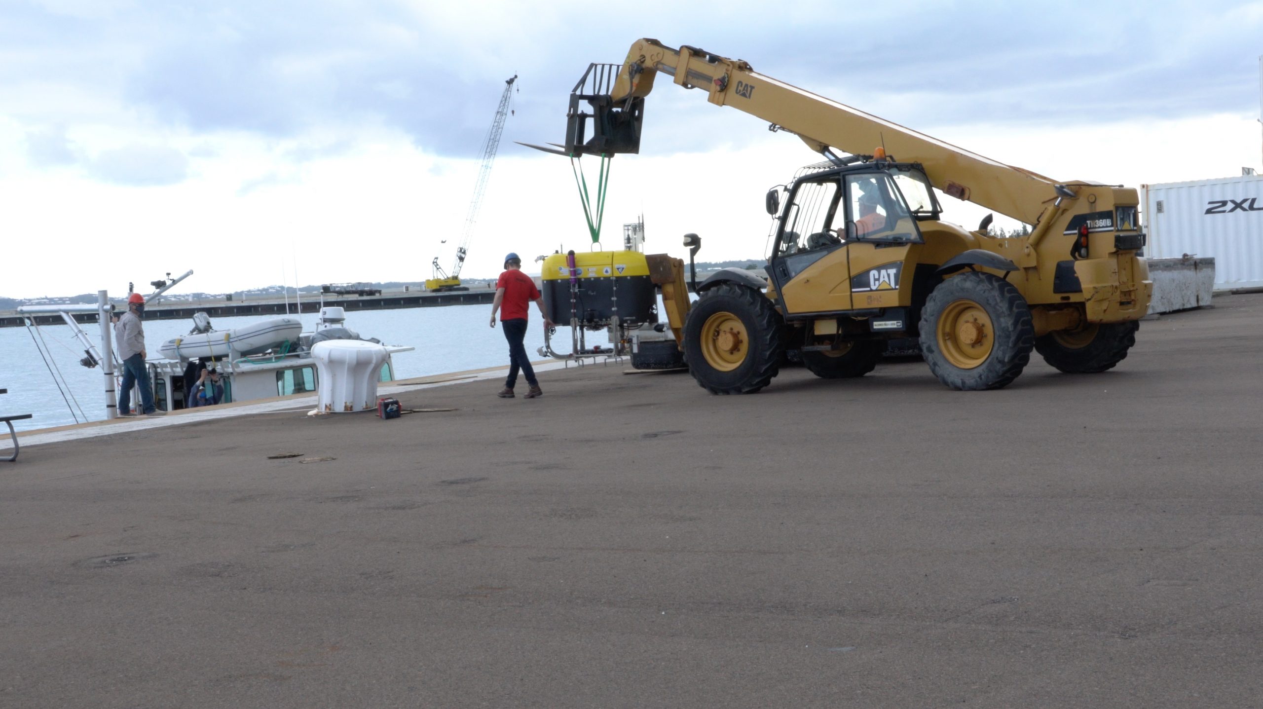 Engineer Fredrick Marin “walks” Mesobot and the forklift to Catapult, which will transport it to a marina for testing in saltwater.