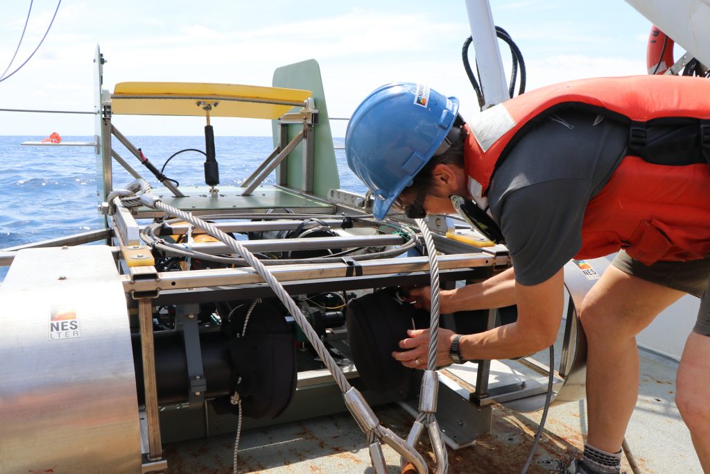 OTZ project lead and WHOI biologist Heidi Sosik prepares the Stingray towed sled for deployment. (Photo by Taylor Crockford © Woods Hole Oceanographic Institution)