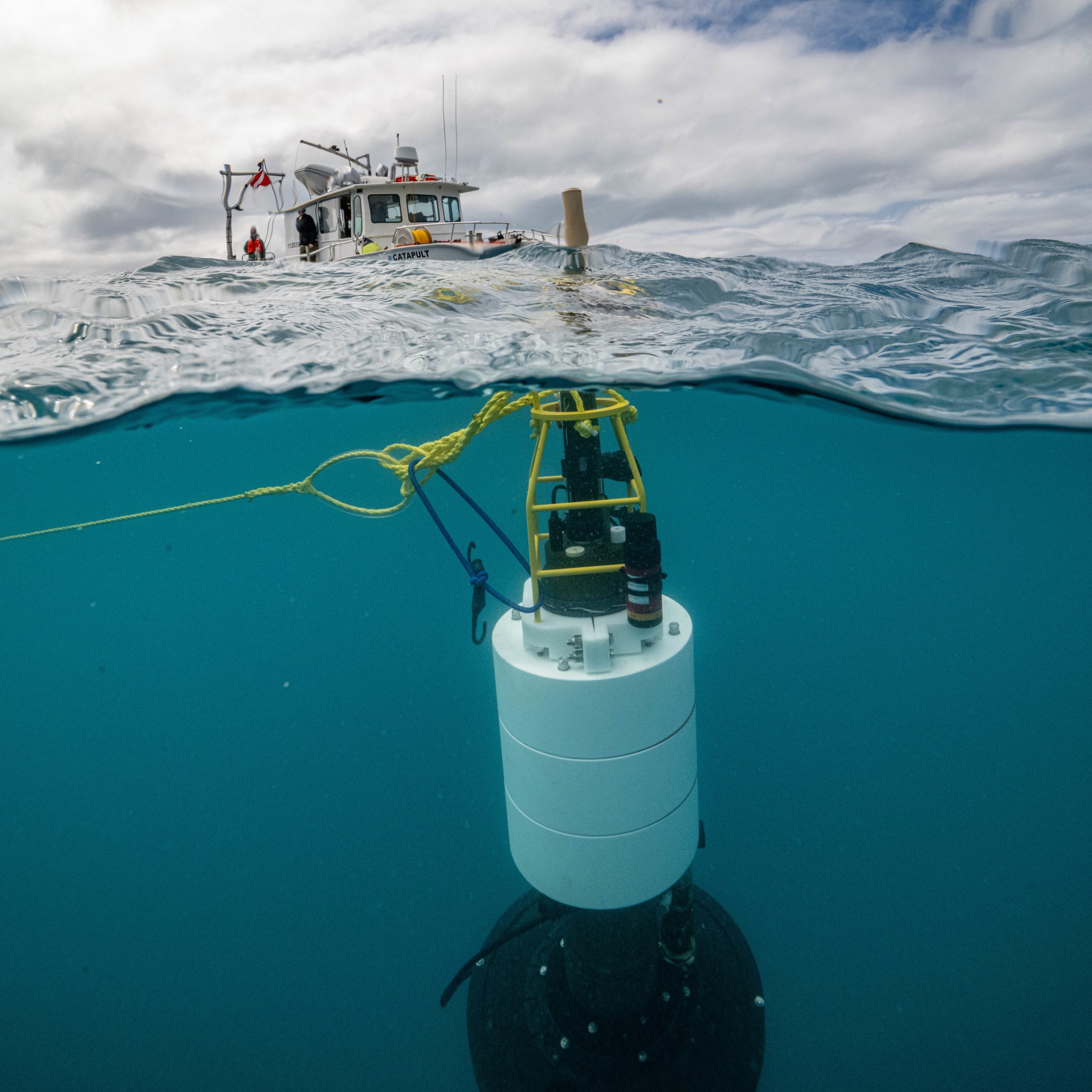 TZEX, the Twilight Zone Explorer, is deployed in the ocean to gather data about marine snow, biological particles that float through the water column, and serve the important role of transporting carbon from surface waters to the deep sea. Photo by Evan Kovacs for the Woods Hole Oceanographic Institution.
