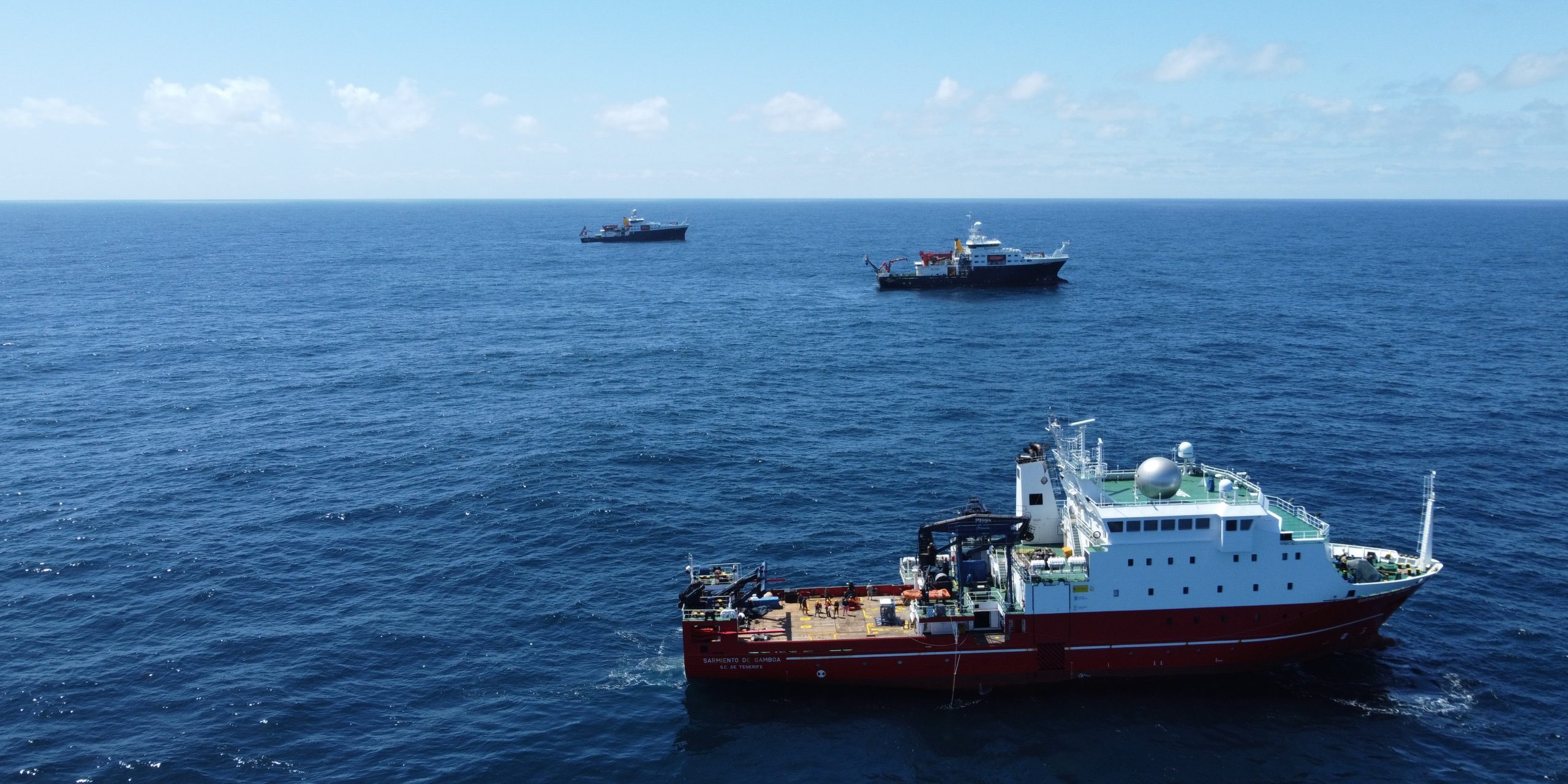 During the EXPORTS expedition, the R/V Sarmiento de Gamboa, the RSS James Cook, and the RSS Discovery are constantly coordinating their science operations — sometimes they get close enough for a group photo.