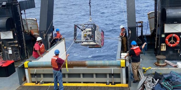 Deep-See is deployed from aboard the R/V Bigelow. While winch trouble has stalled full operations, the team has managed to push forward with modified deployments and manual effort. (Photo by Annette Govindarajan © Woods Hole Oceanograhic Institution)