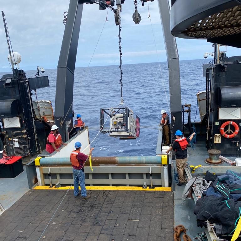 Deep-See is deployed from aboard the NOAA ship <i>Henry B. Bigelow<i>. While winch trouble has stalled full operations, the team has managed to push forward with modified deployments and manual effort. (Photo by Annette Govindarajan © Woods Hole Oceanograhic Institution)