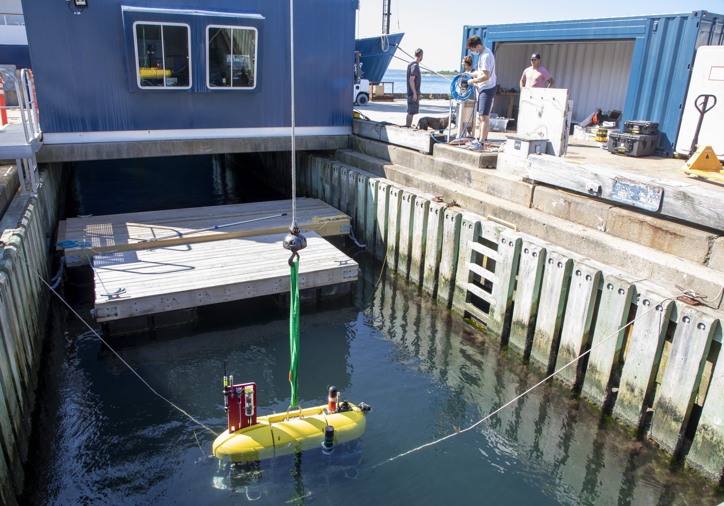 Before <i>Mesobot</i> is lifted aboard the R/V <i>Endeavor</i>, OTZ engineers put the vehicle through its paces in a test well at Woods Hole. The team constantly fine-tunes the vehicle's systems to ensure that its deployment goes smoothly at while at sea.