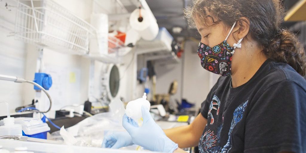 WHOI research assistant Erin Frates processes a batch of samples in the Wet Lab after a Mesobot dive on September 28, 2021. (Photo: OET/Nautilus Live)