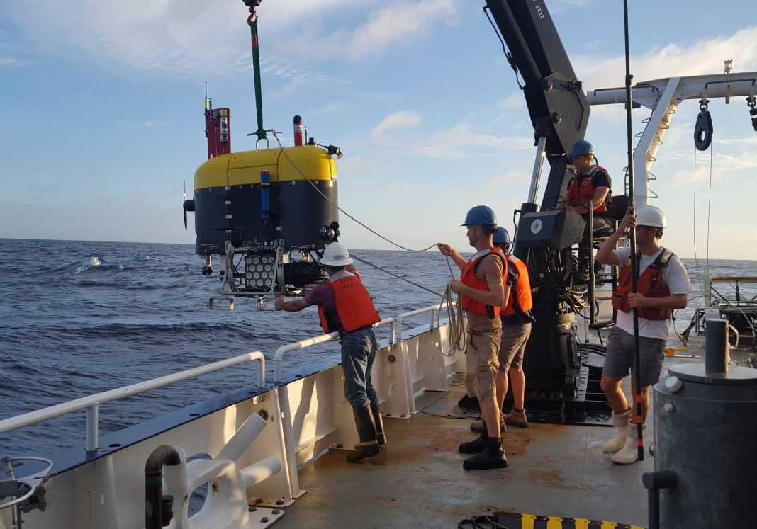 Mesobot is lowered over the side of the R/V Endeavor. This powerful imaging robot captures video of gelatinous animals as well as eDNA samples from the water column. (Photo © Woods Hole Oceanographic Institution)